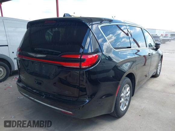2023 Chrysler Pacifica Touring L with VIN 2C4RC1BG1PR550628, listed as a IAAI auction lot 42553430 with 61,773 mi miles and . Bid and sale history available at DreamBid. Image 4.
