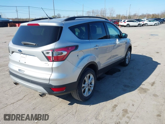 2017 Ford Escape SE with VIN 1FMCU0GDXHUB27848, listed as a IAAI auction lot 42047589 with 128,823 mi miles. Bid and sale history available at carsss.com. Image 4.