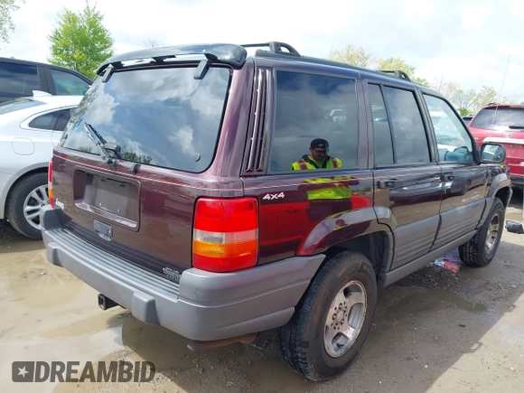 1997 Jeep Grand Cherokee Laredo with VIN 1J4GZ58S4VC702040, listed as a IAAI auction lot 42165536 with 121,803 mi miles and . Bid and sale history available at DreamBid. Image 4.