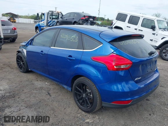 2018 Ford Focus Titanium z VIN 1FADP3N26JL325931, wystawiony jako IAAI lot #42096503 z przebiegiem 106 338 mil mil oraz . Historia ofert i sprzedaży dostępna na DreamBid. Obrazek 3.