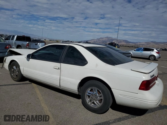 1996 Ford Thunderbird LX z VIN 1FALP62W7TH119284, wystawiony jako Copart lot #71701084 z przebiegiem 239 462 mil mil oraz Szkoda całkowita • Salvage title. Historia ofert i sprzedaży dostępna na DreamBid. Obrazek 2.