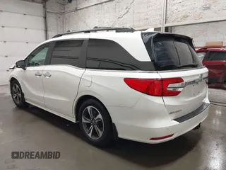 2019 Honda Odyssey Touring with VIN 5FNRL6H8XKB079113, listed as a IAAI auction lot 42359455 with 74,545 mi miles and . Bid and sale history available at DreamBid. Image 3.