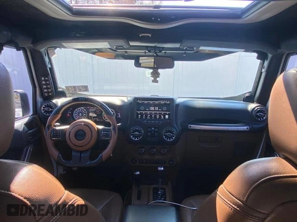 2014 Jeep Wrangler Unlimited Sahara with VIN 1C4BJWEG1EL272951, listed as a Copart auction lot 52157145 with 56,989 mi miles and Clean Title. Bid and sale history available at carsss.com. Image 9.