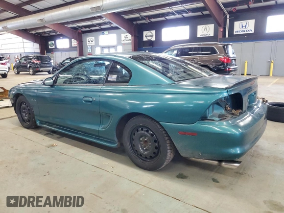 1996 Ford Mustang GT z VIN 1FALP42X5TF191769, wystawiony jako Copart lot #49364525 z przebiegiem 69 029 mil mil oraz Szkoda całkowita • Salvage title. Historia ofert i sprzedaży dostępna na DreamBid. Obrazek 2.