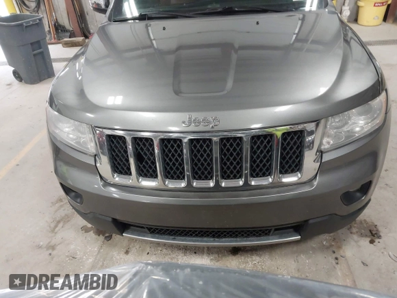 2013 Jeep Grand Cherokee Overland with VIN 1C4RJFCT9DC524605, listed as a IAAI auction lot 42016103 with 215,352 mi miles. Bid and sale history available at carsss.com. Image 12.