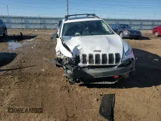2017 Jeep Cherokee Trailhawk L Plus with VIN 1C4PJMBB3HW506965, listed as a Copart auction lot 82257594 with 106,571 mi miles and Salvage title. Bid and sale history available at DreamBid. Image 11.