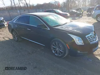 2013 Cadillac XTS with VIN 2G61N5S32D9238652, listed as a IAAI auction lot 40966692 with 90,834 mi miles. Bid and sale history available at carsss.com. Image 1.