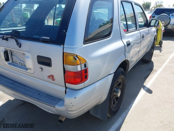 1998 Isuzu Rodeo S with VIN 4S2CM58WXW4325350, listed as a IAAI auction lot 42084411 with 292,784 mi miles. Bid and sale history available at carsss.com. Image 13.