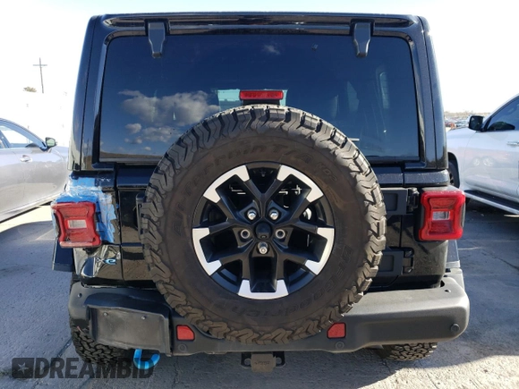 2024 Jeep Wrangler Rubicon with VIN 1C4RJXR69RW132849, listed as a Copart auction lot 48237325 with 18,725 mi miles and Salvage Title. Bid and sale history available at DreamBid. Image 6.