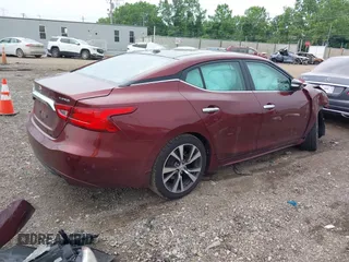 2016 Nissan Maxima SL with VIN 1N4AA6AP9GC401643, listed as a IAAI auction lot 42506704 with 103,197 mi miles and . Bid and sale history available at DreamBid. Image 4.