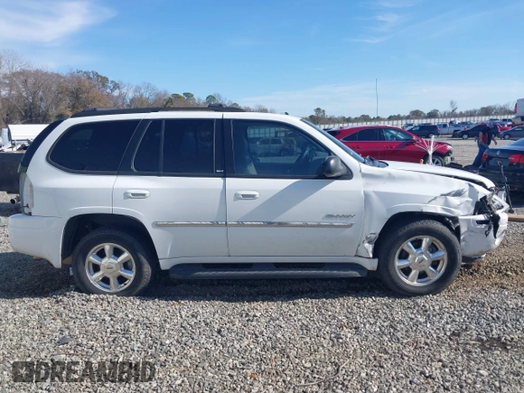 2006 GMC Envoy SLT with VIN 1GKDS13S062128531, listed as a IAAI auction lot 41458983 with 119,385 mi miles. Bid and sale history available at carsss.com. Image 13.