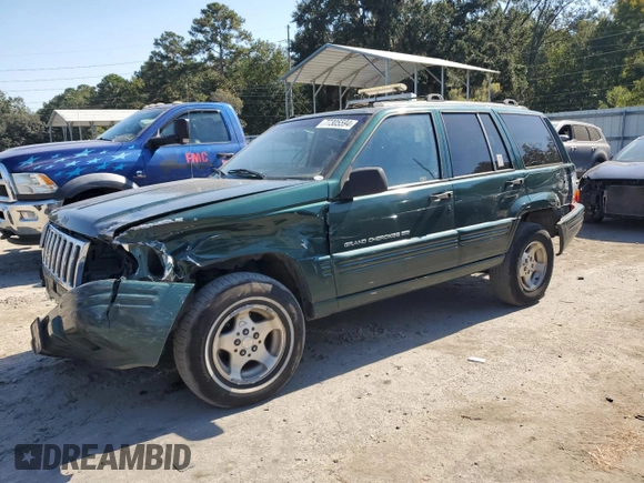 1998 Jeep Grand Cherokee with VIN 1J4FX48S8WC281615, listed as a Copart auction lot 77305594 with 128,393 mi miles and Salvage title. Bid and sale history available at DreamBid. Image 1.