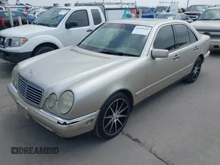 1999 Mercedes-Benz E-Class with VIN WDBJF65H9XA799820, listed as a IAAI auction lot 41959156 with 150,133 mi miles. Bid and sale history available at carsss.com. Image 2.