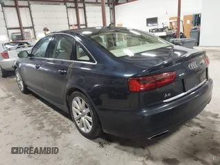 2016 Audi A6 2.0T Premium Plus with VIN WAUGFAFC4GN052293, listed as a IAAI auction lot 41683195 with 85,312 mi miles. Bid and sale history available at carsss.com. Image 3.