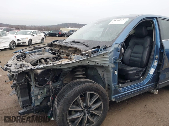 2017 Mazda CX-5 Grand Touring with VIN JM3KFADL9H0187338, listed as a IAAI auction lot 41382034 with 141,972 mi miles and . Bid and sale history available at carsss.com. Image 6.