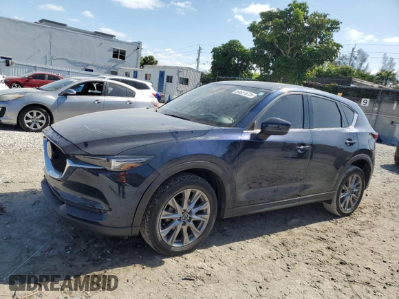 2021 Mazda CX-5 Grand Touring with VIN JM3KFBDM4M1462570, listed as a Copart auction lot 54827675 with 45,389 mi miles and Salvage Title. Bid and sale history available at DreamBid. Image 1.