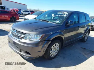 2015 Dodge Journey SE z VIN 3C4PDCAB5FT739266, wystawiony jako IAAI lot #41725086 z przebiegiem 134 109 mil mil oraz . Historia ofert i sprzedaży dostępna na DreamBid. Obrazek 2.
