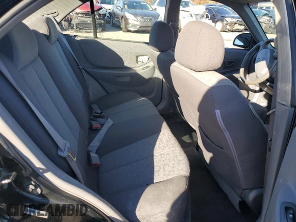 2005 Hyundai Accent GLS z VIN KMHCG45C15U662362, wystawiony jako Copart lot #80574774 z przebiegiem 122 898 mil mil oraz Szkoda całkowita • Salvage title. Historia ofert i sprzedaży dostępna na DreamBid. Obrazek 11.