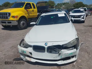 2014 BMW 3 Series 320i with VIN WBA3B1C51EK131063, listed as a IAAI auction lot 42043086 with 92,306 mi miles. Bid and sale history available at carsss.com. Image 12.
