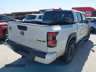 2024 Nissan Frontier PRO-4X with VIN 1N6ED1EKXRN651496, listed as a IAAI auction lot 41801908 with 7,058 mi miles. Bid and sale history available at carsss.com. Image 4.