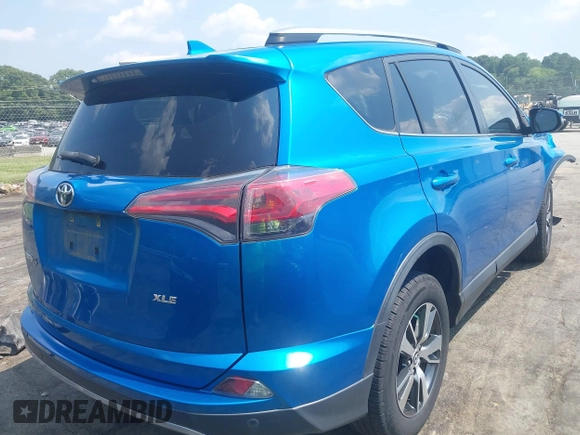 2018 Toyota RAV4 XLE with VIN JTMWFREVXJJ751586, listed as a IAAI auction lot 42586337 with 55,821 mi miles and . Bid and sale history available at DreamBid. Image 4.