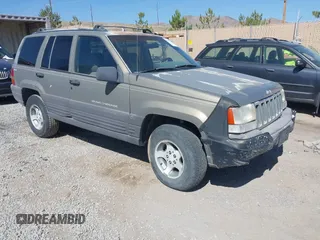 1997 Jeep Grand Cherokee Laredo with VIN 1J4GZ58S3VC603239, listed as a IAAI auction lot 42593915 with 295,696 mi miles and . Bid and sale history available at DreamBid. Image 1.
