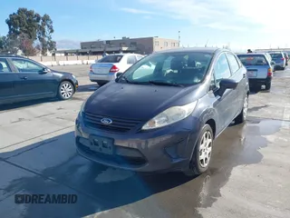 2012 Ford Fiesta S with VIN 3FADP4AJXCM187721, listed as a IAAI auction lot 41269984 with 118,474 mi miles. Bid and sale history available at carsss.com. Image 2.