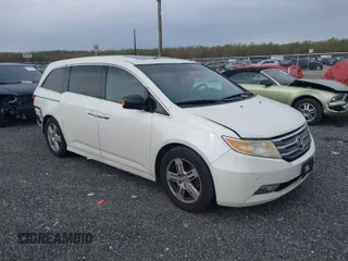 2012 Honda Odyssey Touring with VIN 5FNRL5H91CB119499, listed as a IAAI auction lot 41997265 with 284,353 mi miles. Bid and sale history available at carsss.com. Image 1.