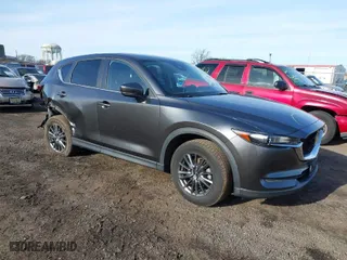 2021 Mazda CX-5 Touring with VIN JM3KFBCM8M0310623, listed as a IAAI auction lot 41502055 with 49,173 mi miles. Bid and sale history available at carsss.com. Image 1.