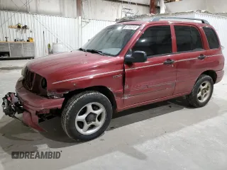 1999 Suzuki Vitara JX z VIN 2S3TD52V4X6110057, wystawiony jako Copart lot #87752215 z przebiegiem 245 419 mil mil oraz Szkody całkowita. Historia ofert i sprzedaży dostępna na DreamBid. Obrazek 1.