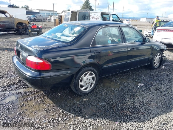 2000 Mazda 626 LX with VIN 1YVGF22CXY5123930, listed as a IAAI auction lot 40712369 with 210,234 mi miles. Bid and sale history available at carsss.com. Image 4.