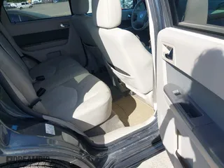 2010 Mercury Mariner with VIN 4M2CN9B75AKJ15058, listed as a IAAI auction lot 42042347 with 220,242 mi miles. Bid and sale history available at carsss.com. Image 8.