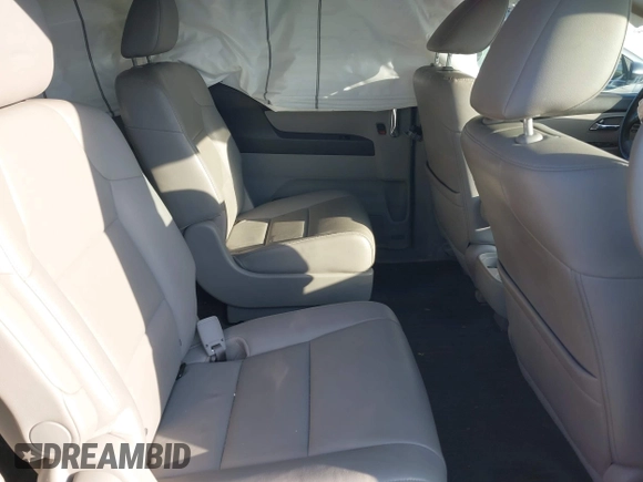 2014 Honda Odyssey Touring with VIN 5FNRL5H90EB077054, listed as a IAAI auction lot 41904456 with 197,869 mi miles and . Bid and sale history available at carsss.com. Image 8.