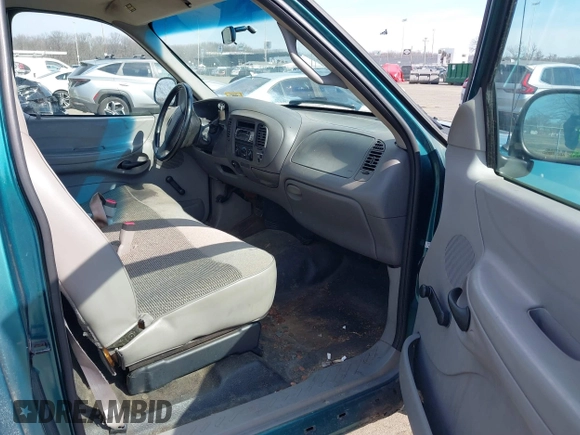 1998 Ford F-150 with VIN 1FTZF1723WNC12776, listed as a IAAI auction lot 41599872 with 125,007 mi miles and . Bid and sale history available at DreamBid. Image 5.