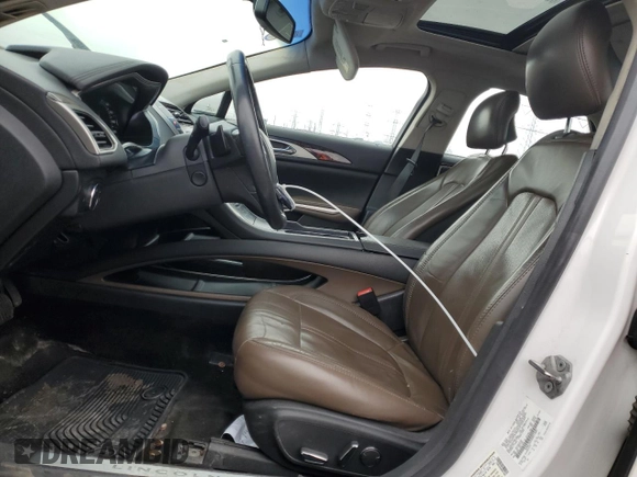 2014 Lincoln MKZ z VIN 3LN6L2G93ER811683, wystawiony jako Copart lot #52004485 z przebiegiem 188 134 mil mil oraz Szkoda całkowita • Salvage title. Historia ofert i sprzedaży dostępna na DreamBid. Obrazek 7.
