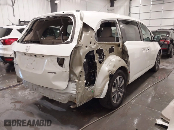 2015 Honda Odyssey Touring Elite with VIN 5FNRL5H92FB020159, listed as a IAAI auction lot 42103240 with 79,322 mi miles and . Bid and sale history available at DreamBid. Image 6.
