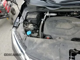 2018 Honda Odyssey Elite z VIN 5FNRL6H99JB098498, wystawiony jako Copart lot #82170395 z przebiegiem 103 313 mil mil oraz Szkoda całkowita • Salvage title. Historia ofert i sprzedaży dostępna na DreamBid. Obrazek 14.