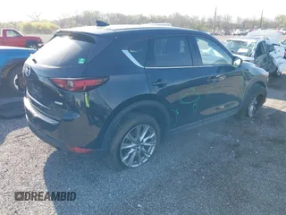 2019 Mazda CX-5 Grand Touring with VIN JM3KFBDM7K0525650, listed as a IAAI auction lot 42032757 with 65,530 mi miles and . Bid and sale history available at DreamBid. Image 4.