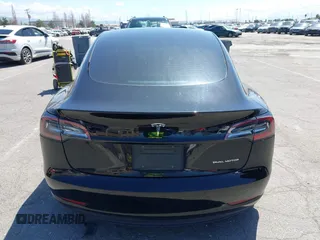 2021 Tesla Model 3 Long Range with VIN 5YJ3E1EB4MF064631, listed as a IAAI auction lot 41424856 with 95,511 mi miles and . Bid and sale history available at DreamBid. Image 16.