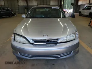 2001 Lexus ES 300 z VIN JT8BF28G910303864, wystawiony jako Copart lot #61811935 z przebiegiem 159 696 mil mil oraz Szkoda całkowita • Salvage title. Historia ofert i sprzedaży dostępna na DreamBid. Obrazek 5.