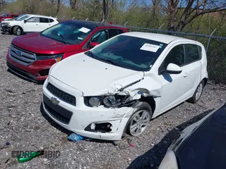 2016 Chevrolet Sonic LT with VIN 1G1JC6SH2G4134831, listed as a IAAI auction lot 41983302 with 85,828 mi miles. Bid and sale history available at carsss.com. Image 2.