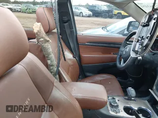 2015 Jeep Grand Cherokee Summit with VIN 1C4RJFJT1FC768707, listed as a IAAI auction lot 41863454 with 122,564 mi miles. Bid and sale history available at carsss.com. Image 5.