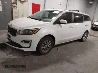 2019 Kia Sedona L with VIN KNDMA5C1XK6524868, listed as a IAAI auction lot 41048602 with 82,511 mi miles. Bid and sale history available at carsss.com. Image 2.