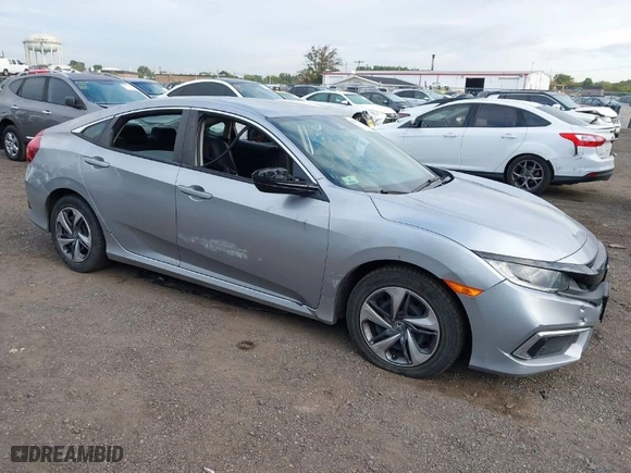 2019 Honda Civic Sedan LX with VIN 2HGFC2F65KH586106, listed as a IAAI auction lot 40486735 with 82,714 mi miles. Bid and sale history available at carsss.com. Image 1.