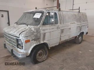 1992 Chevrolet Chevy Van z VIN 2GCEG25Z3N4144138, wystawiony jako IAAI lot #42389578 z przebiegiem 129 513 mil mil oraz . Historia ofert i sprzedaży dostępna na DreamBid. Obrazek 2.