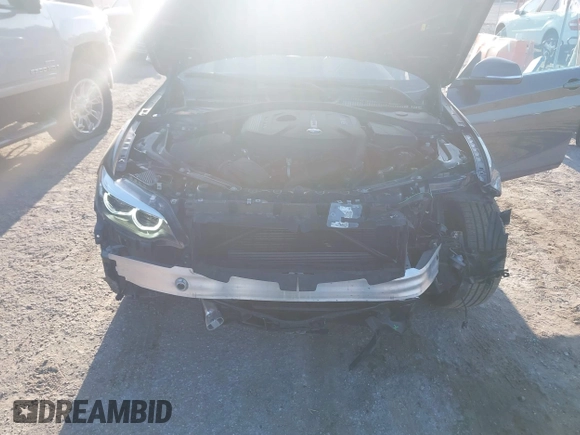 2020 BMW 2 Series 230i xDrive with VIN WBA2K1C08L7G28887, listed as a IAAI auction lot 42122785 with 30,599 mi miles and . Bid and sale history available at carsss.com. Image 6.