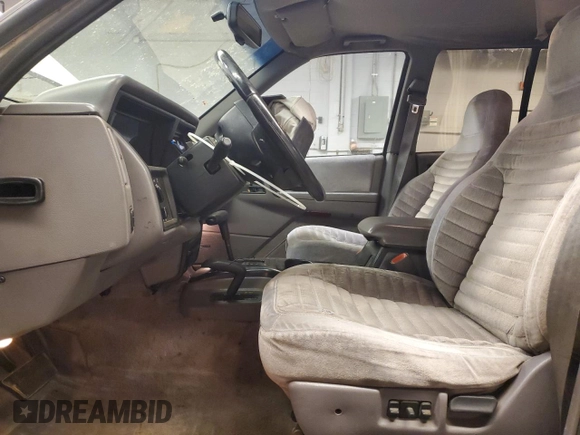1993 Jeep Grand Cherokee Laredo with VIN 1J4GZ58SXPC554642, listed as a Copart auction lot 83268254 with 266,063 mi miles and Salvage Title. Bid and sale history available at carsss.com. Image 7.