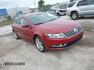 2014 Volkswagen CC Sport with VIN WVWBN7AN0EE527558, listed as a IAAI auction lot 41336204 with 130,005 mi miles. Bid and sale history available at carsss.com. Image 1.
