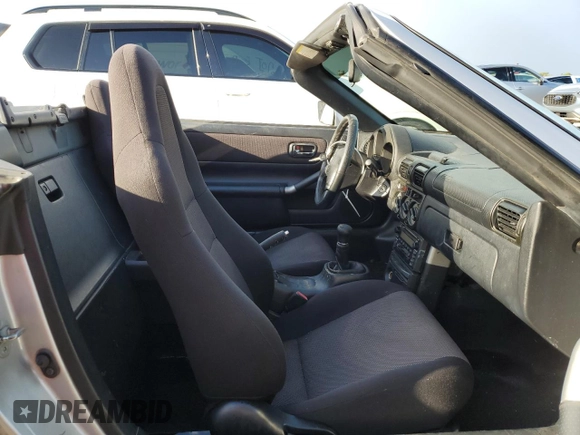 2001 Toyota MR2 z VIN JTDFR320410036287, wystawiony jako Copart lot #73851984 z przebiegiem Nie podano mil oraz Szkody całkowita. Historia ofert i sprzedaży dostępna na DreamBid. Obrazek 10.