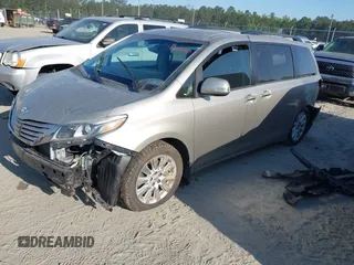 2015 Toyota Sienna XLE with VIN 5TDYK3DC0FS632909, listed as a IAAI auction lot 42012143 with 97,084 mi miles and . Bid and sale history available at DreamBid. Image 2.
